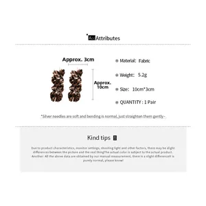 Detailed view of leopard print fabric flower tassel earrings with size and weight metrics