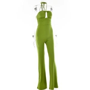 Detail of green halter neck jumpsuit with front cutout on a transparent mannequin