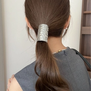Silver hammered texture ponytail clip for women in a minimalist metallic fashion style