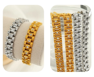 Detailed view of gold and silver watch-strap link bracelets with inset rhinestones