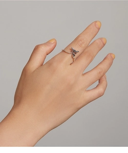 Detailed view of an S925 sterling silver dragonfly open ring worn on a finger