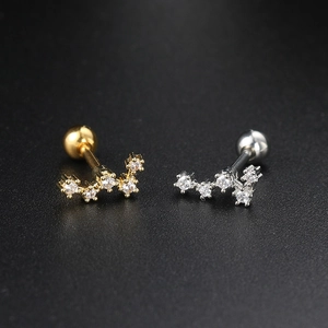 Celestial zircon ear studs in gold and silver finish with screw ball backings