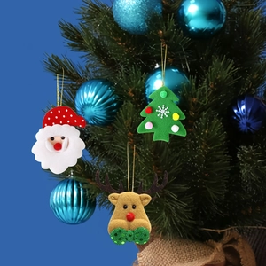 Detail of felt Christmas ornaments featuring Santa, reindeer, and tree hanging on a tree