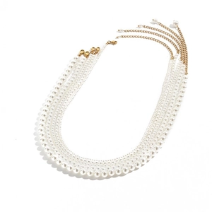 Detail of 14K gold plated four-layer pearl necklace with lobster clasp and extension chain
