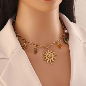 Gold stainless steel necklace featuring colorful sun and star pendants on a model
