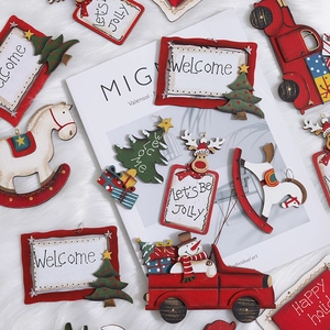 Assorted wooden Christmas ornaments featuring vintage trucks, reindeer and trees