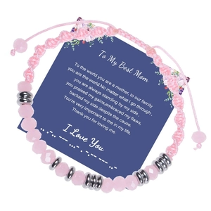 Pink Morse code woven bracelet with rose quartz beads on a blue Mother's Day gift card