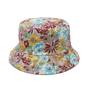 Close-up of a cotton bucket hat with vibrant floral patterns and sunflower print