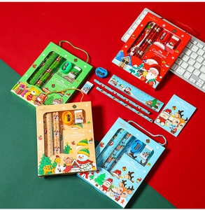 Close-up of Christmas stationery set with pencils, rulers and notebooks in festive boxes