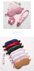 Macro detail of luxurious silk satin sleep eye mask set with matching scrunchie and headband