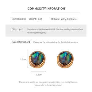 Detail view of 18K gold plated oval earrings featuring mother of pearl inlay and dimensions