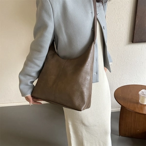 Retro brown faux leather hobo shoulder bag shown on model for daily commuting fashion
