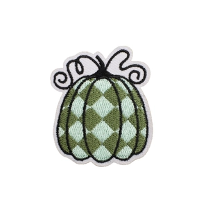 Artistic green pumpkin embroidery patch with plaid texture and stitched black edges
