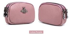 Detail of mauve leather coin purse featuring triple zippers and vintage bee hardware