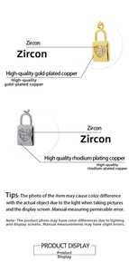Detailed close-up of 18K gold plated heart padlock charms with sparkling zircon inlay
