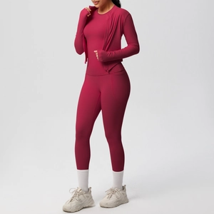 Detailed close-up of yoga set showing the pocket design and moisture-wicking red fabric
