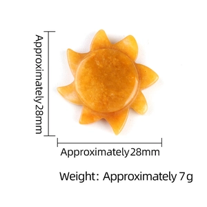 Solar shaped yellow tiger eye stone carving measuring 28mm and weighing 7g on white background