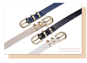 Detail view of four slim fashion belts in navy, beige, black, and white with gold buckles