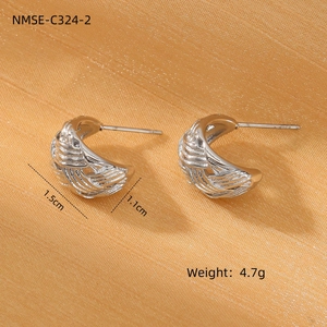 Macro detail of silver pleated hoop earrings showing 1.5cm size and 4.7g weight