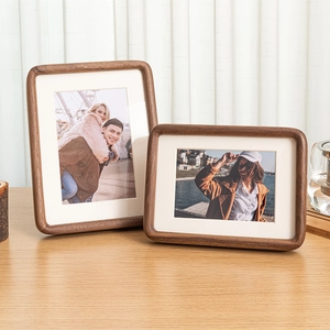 Solid walnut wood picture frame set with rounded corners and thick cream matting