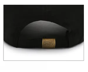 Detail of adjustable metal buckle with star pattern on black quick-dry baseball cap