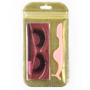 Detail view of 3D dense false eyelashes #107 with pink tweezers and brush in gold pouch