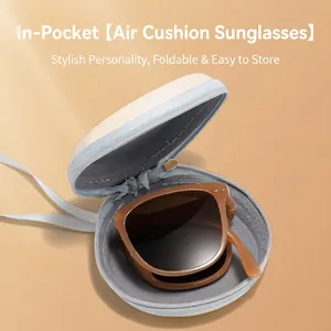 Foldable cat-eye sunglasses with amber frames and a white portable storage case
