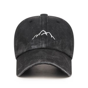 Vintage washed black baseball cap with white mountain embroidery in a classic outdoor style