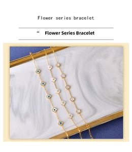 Detailed macro of golden flower series bracelets with blue enamel and shell textures