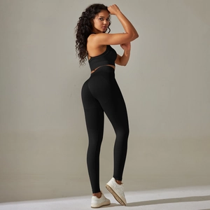 Detail of black seamless yoga set showing high waist leggings and breathable sports bra