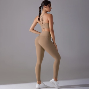 Detail of khaki yoga set showing cross back sports bra and high waist leggings
