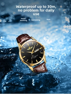 Close-up of golden quartz watch with brown leather strap splashing in water 30m waterproof