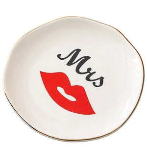 Nordic 4-inch irregular ceramic jewelry tray with gold rim and Mrs lip print