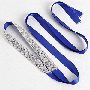 Sparkling blue satin bridal sash with intricate silver crystal rhinestone trim for wedding gown