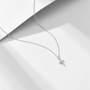 Minimalist sterling silver cross necklace with pavé cubic zirconia on slim O-chain