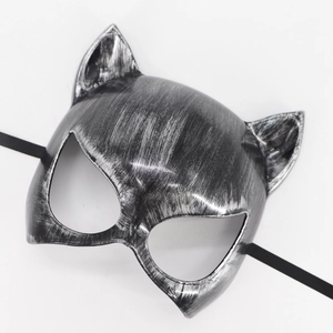 Close-up of silver and black cat mask with metallic texture for masquerade parties