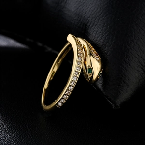 Adjustable snake ring in 18K gold plated copper with white zircon and green crystal eyes
