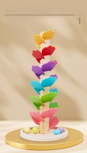 Detailed close-up of colorful heart-shaped leaves and wooden balls on a rainbow music tree