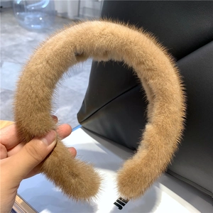 Detail of soft brown faux mink fur headband showing plush fluffy texture and material