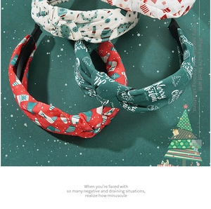Detailed close-up of three festive knotted headbands with Merry Christmas holiday patterns
