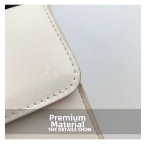 Detailed macro view of premium white leather texture and neat stitching on a square bag