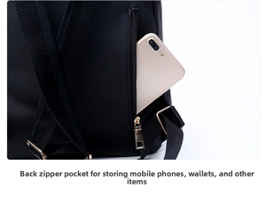 Detail view of anti-theft back zipper pocket on black oxford backpack with a smartphone