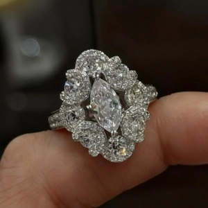 Luxurious marquise cut zircon open ring with elegant cluster diamond setting in white gold