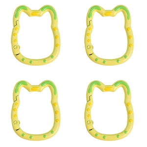 Detail of four yellow cat-ear shaped plastic lobster clasps with green polka dots