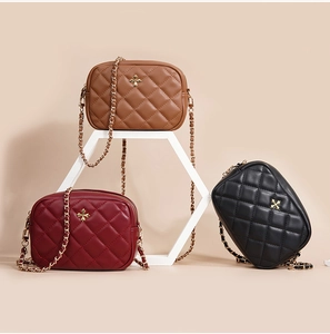 Three colors of quilted PU leather mini crossbody bags with gold chain straps and metal logos