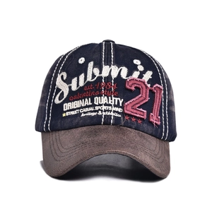 Detail of 3D embroidery and vintage patch on contrast bill street style baseball cap