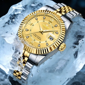 Detail of waterproof gold dial watch with calendar display submerged in ice and water