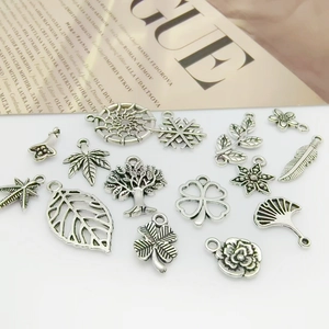 Collection of vintage silver leaf and flower alloy charms for DIY jewelry making