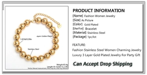 Detail of 10mm golden stainless steel bead bracelet showing size and material tag