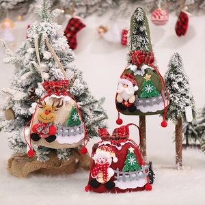 Three festive Christmas burlap drawstring gift bags with Santa, Reindeer and Snowman dolls
